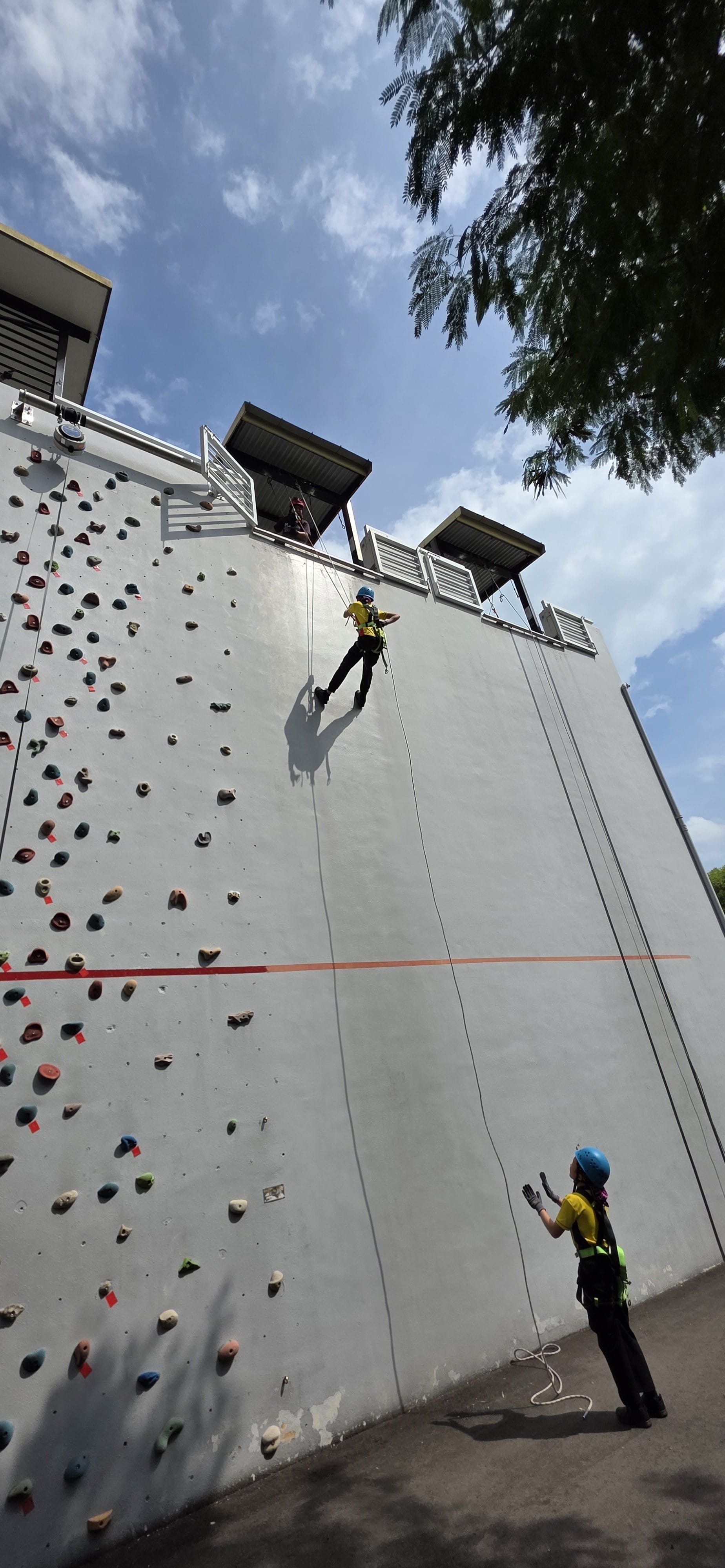 Students bravely conquering the abseiling wall